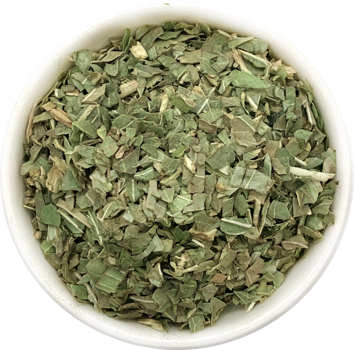 Basil freeze-dried herbs in a bowl — top view